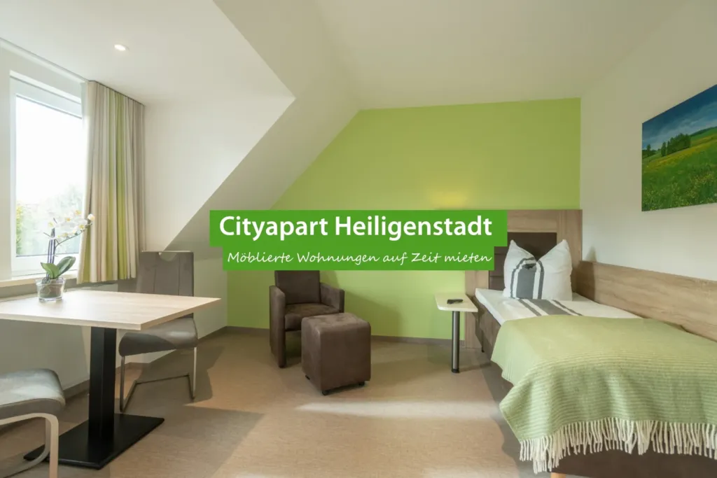 Möbliertes Apartment im CityApart Heiligenstadt mit Sitzbereich und Einzelbett zum Wohnen auf Zeit